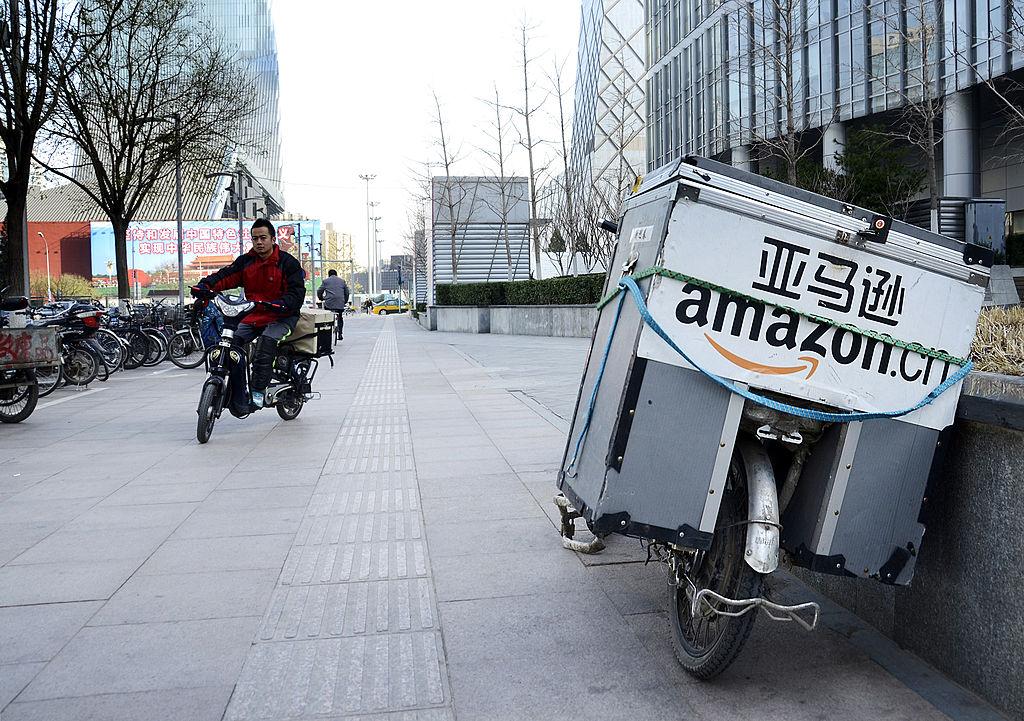 An electric delivery bike used by Amazon sits parked along the pavement at a central business district in Beijing on Nov. 29, 2012. (Wang Zhao/AFP/Getty Images)