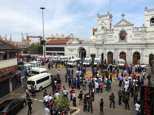 Sri Lankan military officials stand guard in front of St. Anthony's Shrine, Kochchikade church, after an explosion in Colombo, Sri Lanka, on April 21, 2019. (Dinuka Liyanawatte/Reuters)