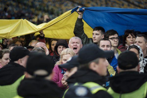 Ukrainians attend a raucous presidential debate at Kiev’s Olympic Stadium on April 19, 2019. (Chris Collison for The Epoch Times)