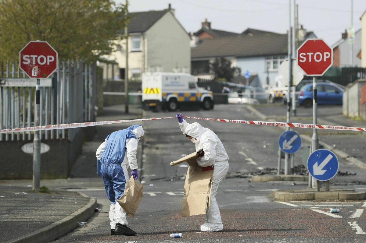 Police forensic officers at the scene in Londonderry, Northern Ireland, on April 19, 2019, following the death of 29-year-old journalist Lyra McKee who was shot and killed during overnight rioting. (Brian Lawless/PA via AP)