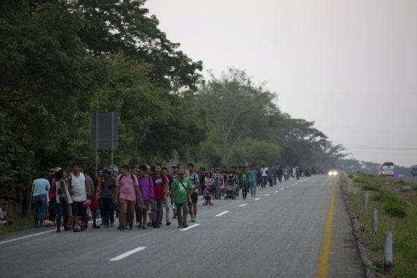 Central American migrants traveling in a caravan to the United States border walk on a road in Pijijiapan, Mexico, on April 22, 2019. (Moises Castillo/AP Photo)