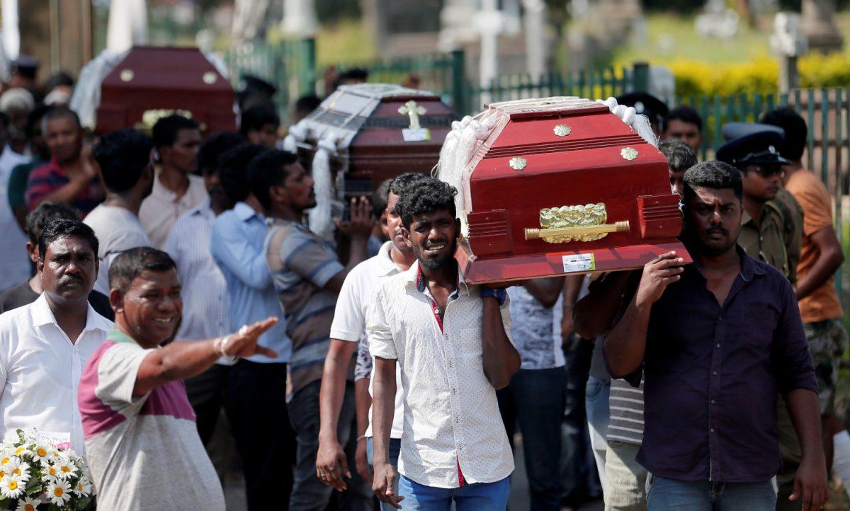 Coffins of victims are carried during a mass for victims, two days after a string of suicide bomb attacks on churches and luxury hotels across the island on Easter Sunday, in Colombo, Sri Lanka, on April 23, 2019. (Dinuka Liyanawatte/Reuters)