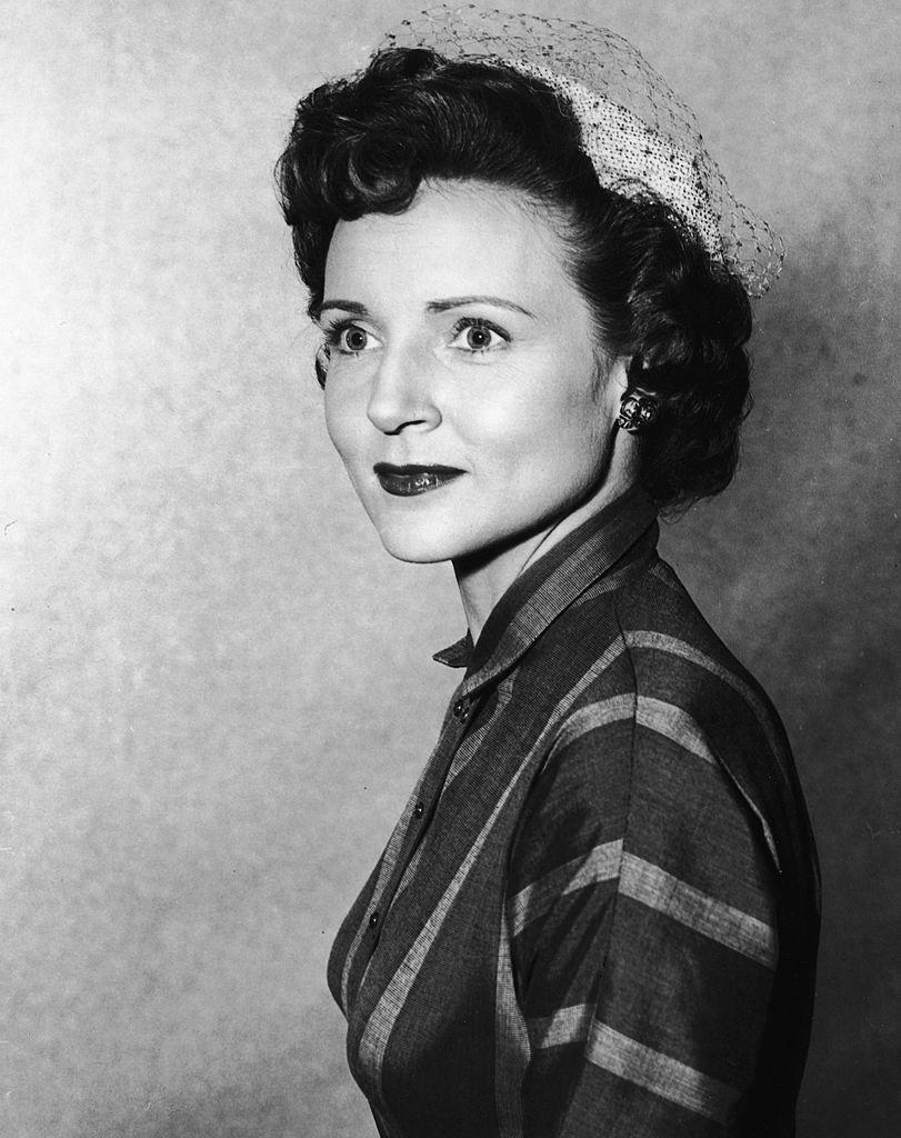 A headshot portrait of the beautiful Betty White wearing a veiled hat, circa 1955 (©Getty Images | <a href="https://www.gettyimages.com/detail/news-photo/headshot-portrait-of-american-actor-betty-white-wearing-a-news-photo/2827580">Hulton Archive</a>)