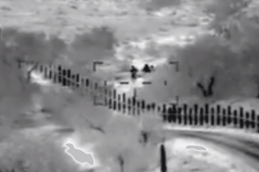 Video Shows Armed Men Escorting Mother and Son Across US Border