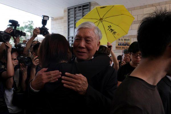 Occupy Central pro-democracy movement founder Chu Yiu-ming hugs a supporter after he had his suspended sentence on his involvement in the Occupy Central, also known as "Umbrella Movement" in Hong Kong, China on April 24, 2019. (Tyrone Siu/Reuters)