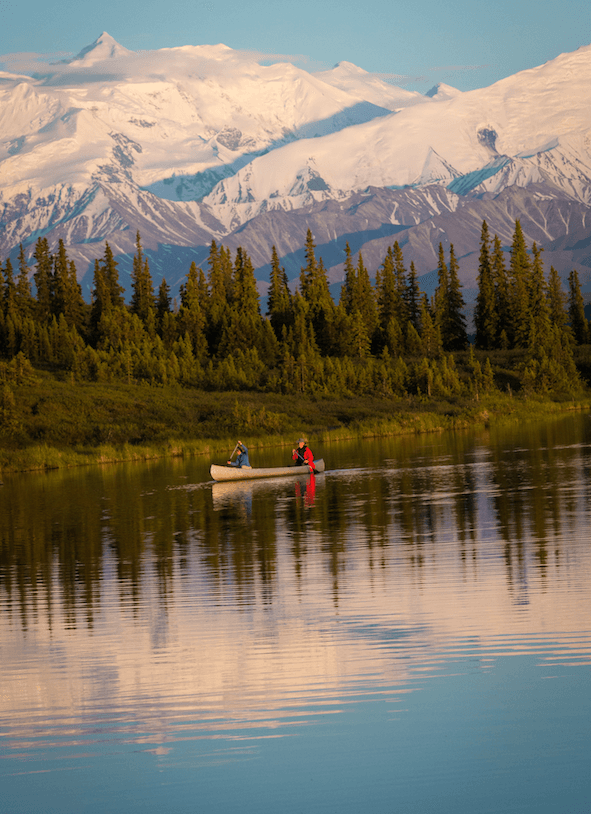 Denali National Park visitors paddle through Wonder Lake.<br/>(State of Alaska/Jocelyn Pride)