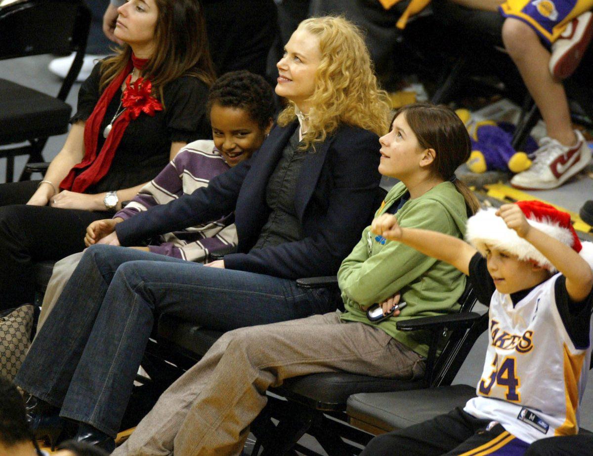 Actress Nicole Kidman (C) and her children from her earlier marriage with Tom Cruise, Connor (2nd-L) and Isabella (2nd-R) attend a game between the Los Angeles Lakers and the Miami Heat at the Staples Center, in Los Angeles, on Dec. 25, 2004. (Matthew Simmons/Getty Images)