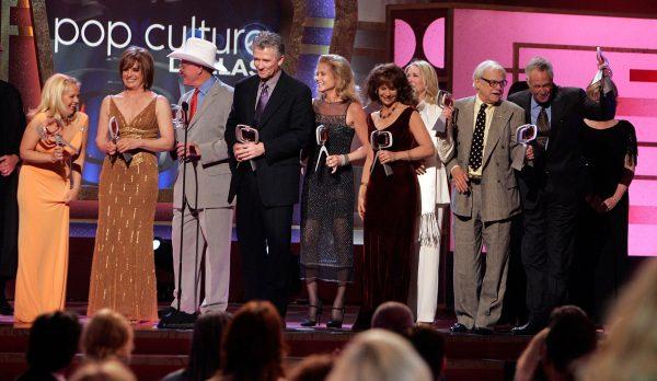 Dallas Cast Charlene Tilton, Linda Gray, Larry Hagman, Patrick Duffy, Sheree J. Wilson, Mary Crosby, Susan Howard, Ken Kercheval, and Steve Kanaly accept the Pop Culture Award onstage at the 2006 TV Land Awards at the Barker Hangar in Santa Monica, Calif., on March 19, 2006. (Kevin Winter/Getty Images)