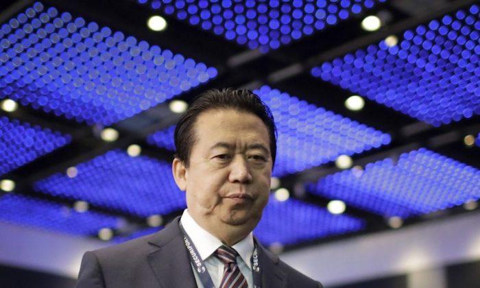 China Charges Former Interpol President With Bribery