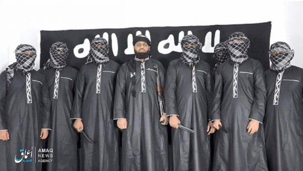 An undated image posted by the ISIS “news agency” Amaq on April 23, 2019. It shows eight men, all with faces obscured except for Mouvli Zahran Hasim in the middle. (Amaq News Agency)