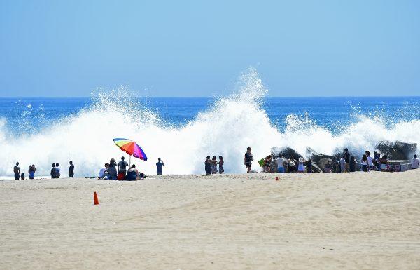Giant waves crash into the rocks at Venice Beach on July 24, 2018. (Jayne Kamin-Oncea/Getty Images)