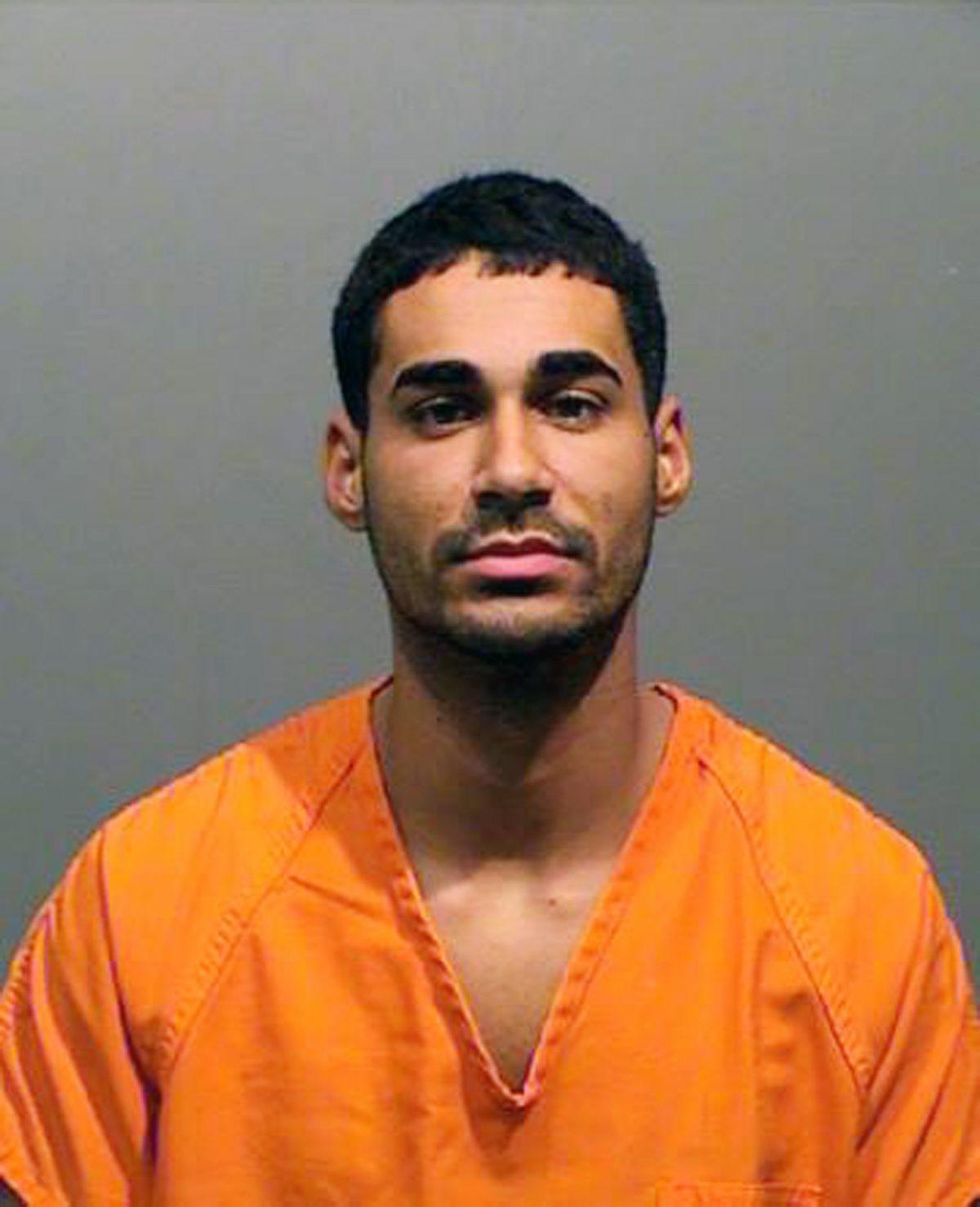 This photo provided by the Lakewood Police Department on April 26, 2019, shows Rogel Lazaro Aguilera-Mederos, 23. The truck driver was arrested Friday on suspicion of vehicular homicide. Police are blaming him for causing a deadly pileup on Interstate 70 near Denver on April 25, 2019. (Lakewood Police Department via AP)