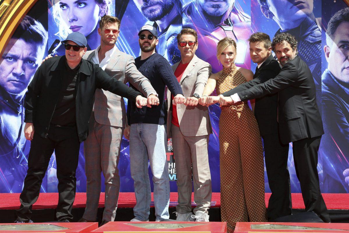 Marvel Studios President Kevin Feige, from left, poses with members of the cast of "Avengers: Endgame," Chris Hemsworth, Chris Evans, Robert Downey Jr., Scarlett Johansson, Jeremy Renner and Mark Ruffalo at a hand and footprint ceremony at the TCL Chinese Theatre in Los Angeles on April 23, 2019. (Willy Sanjuan/Invision/AP)