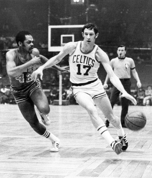 Boston Celtics' John Havlicek (17) protects the ball with his body from Atlanta Hawks' Walt Hazzard (42) during an NBA basketball game in Boston, on Jan. 8, 1970. (File photo/AP)
