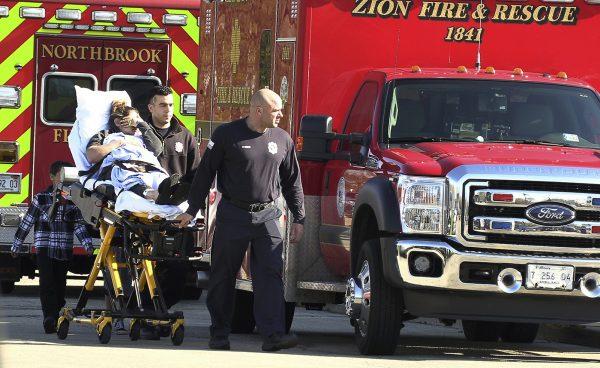 After an ammonia spill in Beach Park, an injured woman arrives at Vista East Medical Center in Waukegan, Ill., on April 25, 2019. (Joe Shuman/Chicago Tribune via AP)