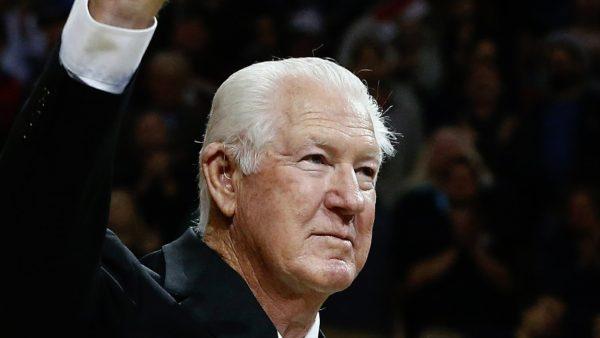 Former Boston Celtics great John Havlicek waves while being honored on the court after the first quarter of an NBA basketball game against the Toronto Raptors in Boston, on April 14, 2015. (Michael Dwyer/File photo via AP)
