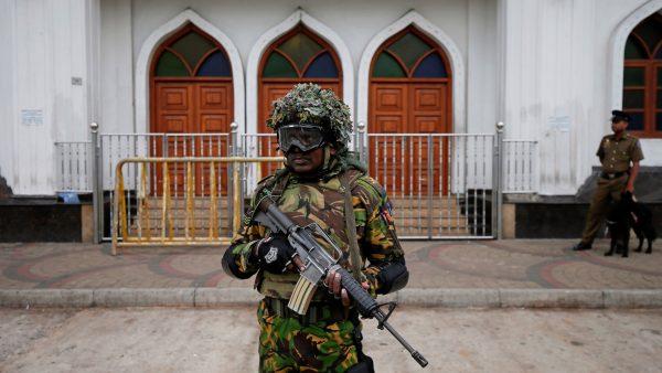 Sri Lankan Special Task Force soldiers stand guard in front of a mosque in Colombo, Sri Lanka, on April 26, 2019. (Dinuka Liyanawatte/Reuters)
