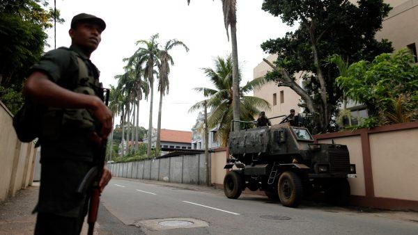 Soldiers stand guard outside the residence of cardinal Malcolm Ranjith, the archbishop of Colombo, in Colombo, Sri Lanka, on April 26, 2019. (Thomas Peter/Reuters)