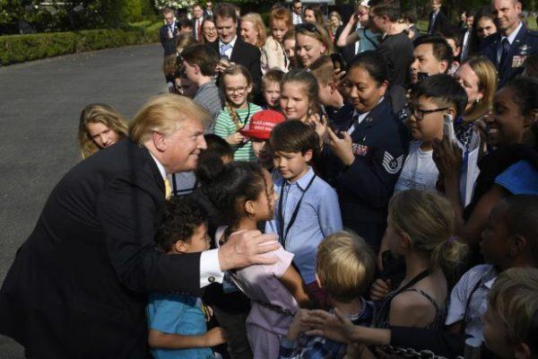 President Donald Trump greets children after speaking to them on the South Lawn of the White House, on April 25, 2019. (Susan Walsh/Ap Photo)