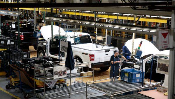 An employee works on the assembly line for the Ford 2018 and 2019 F-150 truck at the Ford Motor Company's Rouge Complex in Dearborn, Mich., on Sept. 27, 2018. (Jeff Kowalsky/AFP/Getty Images)