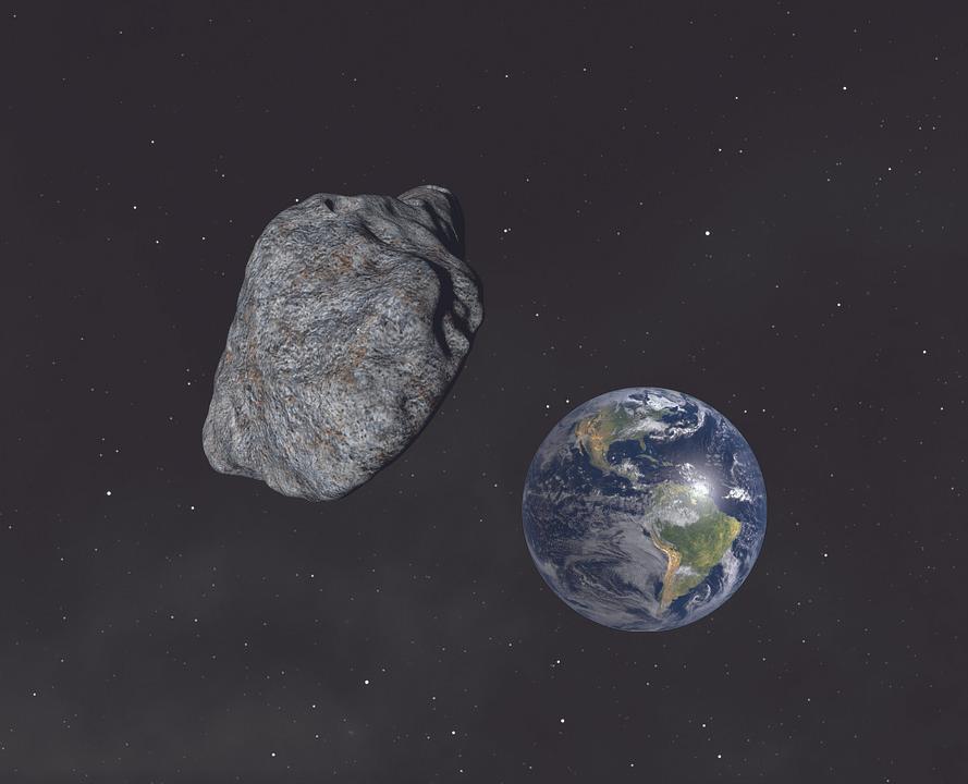 A graphical representation of an asteroid in space and earth in the background. (Urikyo33/Pixabay)