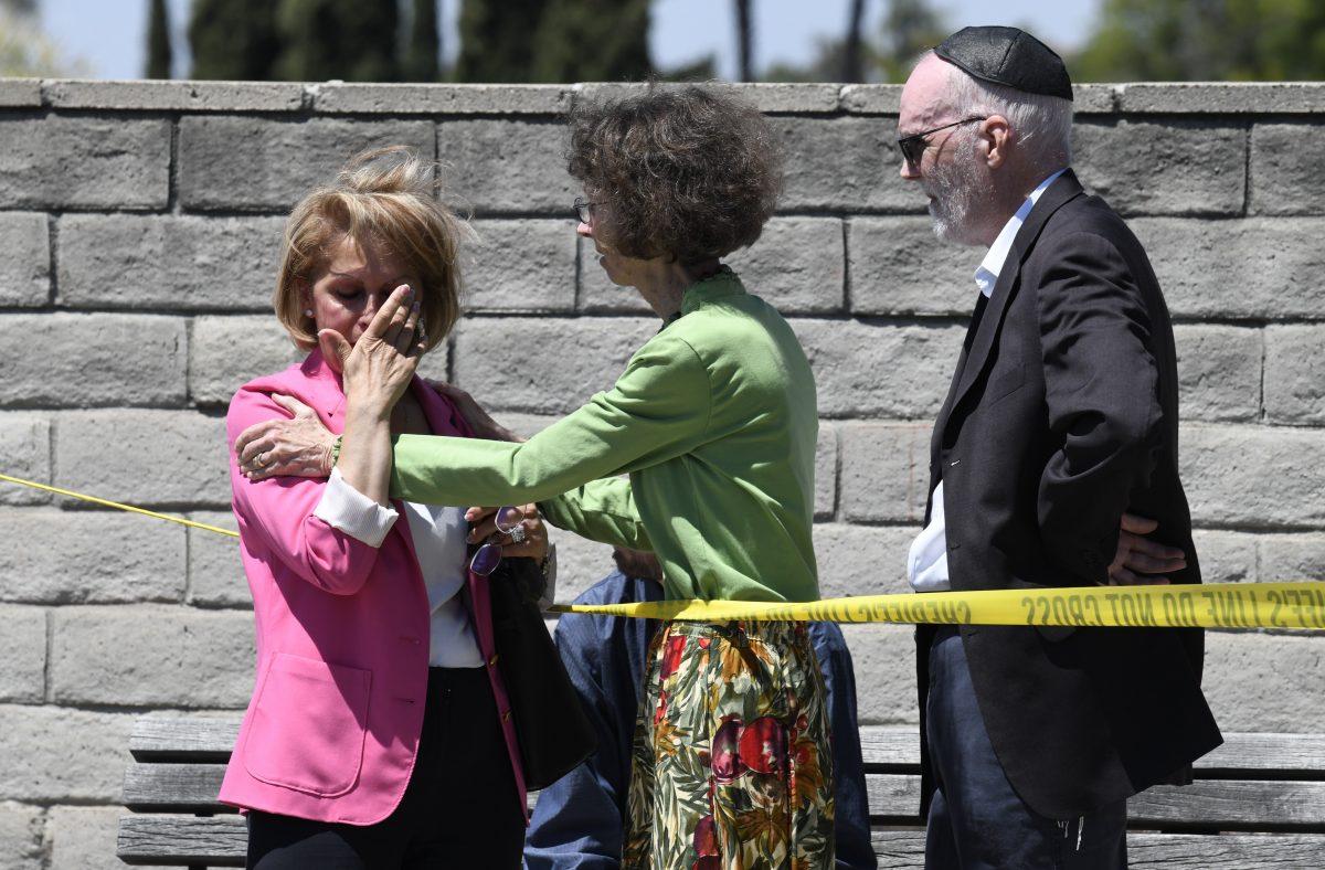 Synagogue members console one another outside of the Chabad of Poway Synagogue in Poway, Calif., on April 27, 2019. (Denis Poroy/AP Photo)