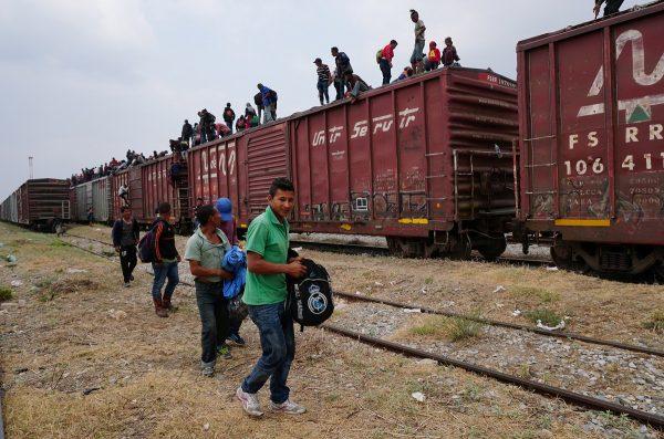 Central American migrants, moving in a caravan through Juchitan, Oaxaca are pictured atop a train known as "The Beast" while continuing their journey toward the United States, in Mexico, on April 26, 2019. (Jose Cortes/Reuters)