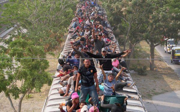 Central American migrants, moving in a caravan through Juchitan, Oaxaca are pictured atop a train known as "The Beast" while continuing their journey toward the United States, in Mexico, on April 26, 2019. (Jose Cortes/Reuters)