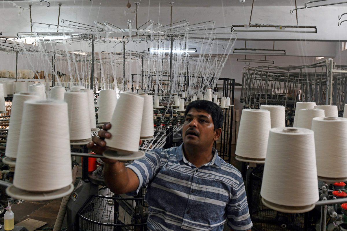 A factory worker works at a textile production unit in the south Indian city of Tiruppur on March 25, 2019. (Arun Sankar/AFP/Getty Images)