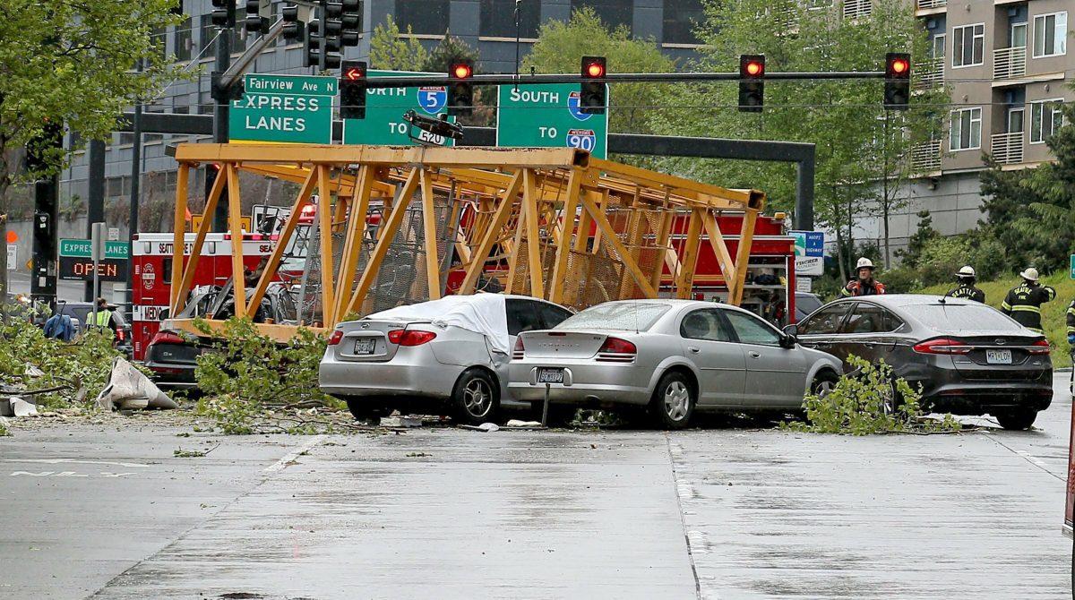 A construction crane fell into eastbound and westbound Mercer Street near Fairview Avenue East, in Seattle, on April 27, 2019. (Greg Gilbert/The Seattle Times via AP)