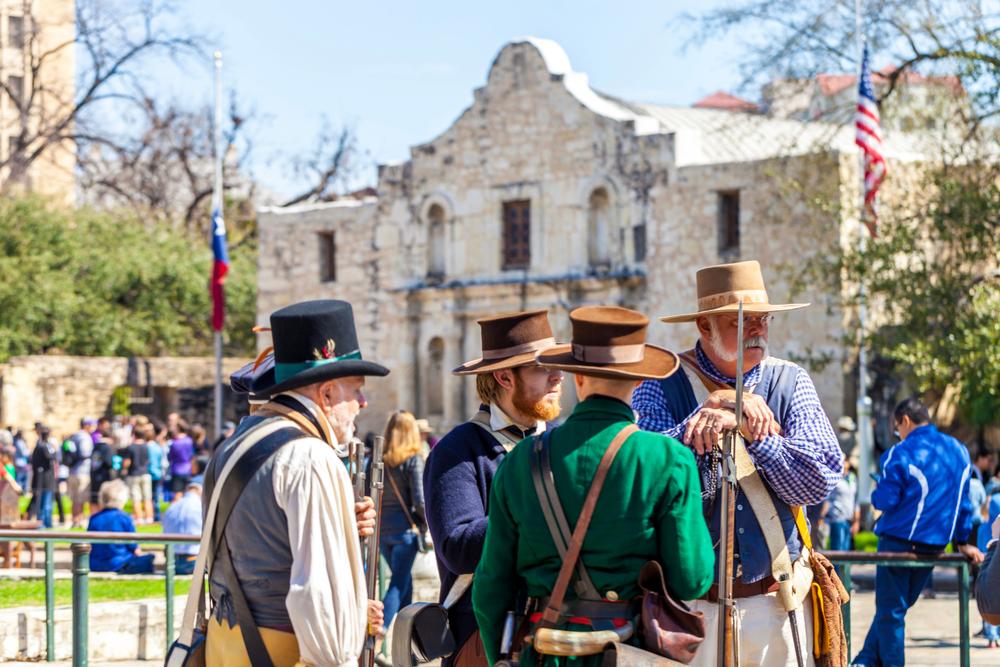 Men dressed as 19th century soldiers participate in the reenactment of the 1836 Battle of the Alamo, on March 2, 2018.