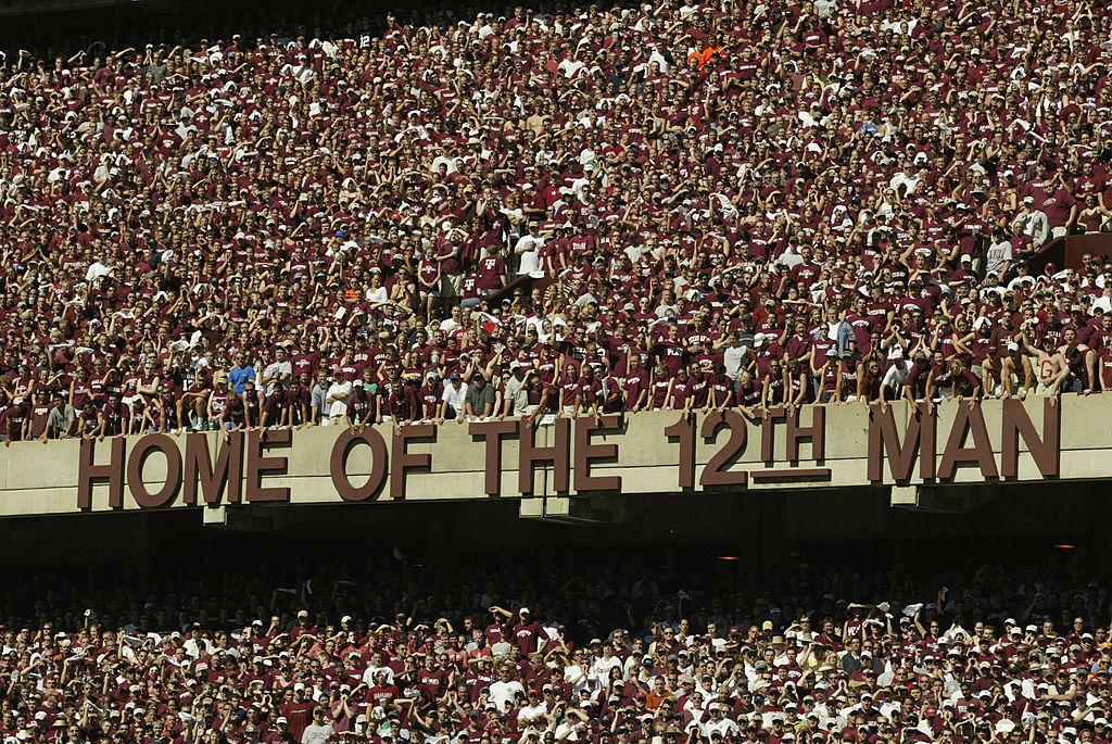 Fans of the Texas A&M Aggies proudly stand during the NCAA football game against the Virginia Tech Hokies in this file photo from Sept. 21, 2002 at Kyle Field in College Station, Texas. (Ronald Martinez/Getty Images)