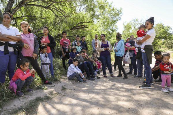 A group of illegal aliens who have just crossed the Rio Grande from Mexico near McAllen, Texas, on April 18, 2019. (Charlotte Cuthbertson/The Epoch Times)