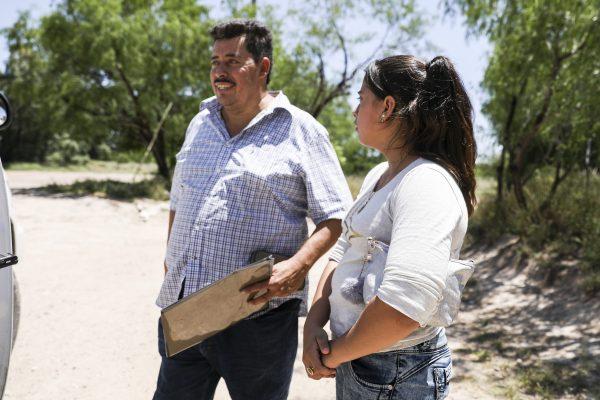 Wilfredo Montufar Lopez and a minor from Honduras just illegally crossed the Rio Grande from Mexico near McAllen, Texas, on April 18, 2019. (Charlotte Cuthbertson/The Epoch Times)