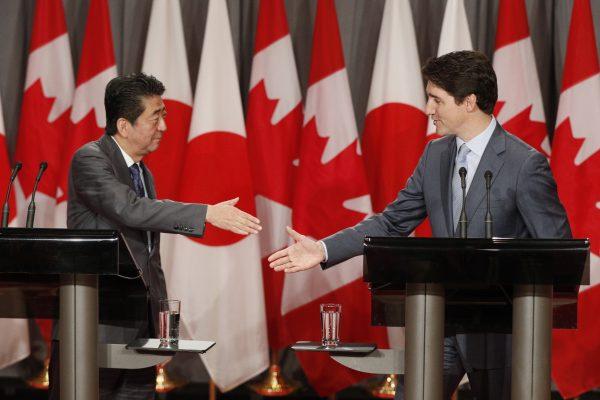 Japanese Prime Minister Shinzo Abe and Canadian Prime Minister Justin Trudeau shake hands during a joint media availability in Ottawa on April 28, 2019. (Lars Hagberg/AFP/Getty Images)