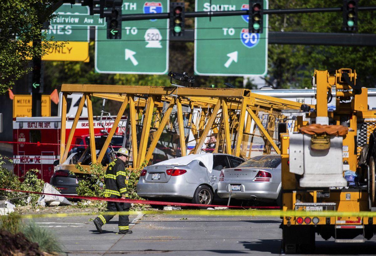 Emergency crews work the scene of a construction crane collapse in Seattle, on April 27, 2019. (Joshua Bessex/The News Tribune via AP)