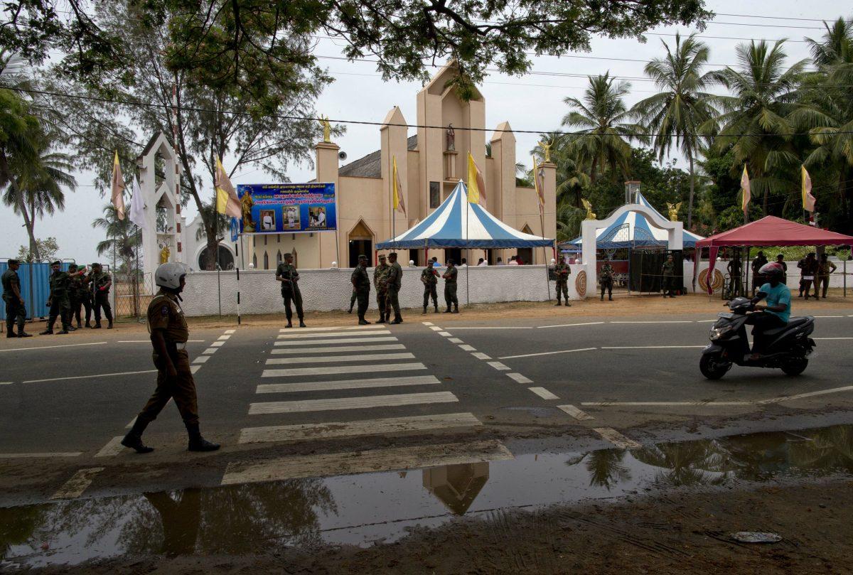 Soldiers outside St. Joseph's church in Thannamunai, Sri Lanka on April 30, 2019. (Gemunu Amarasinghe/AP Photo)