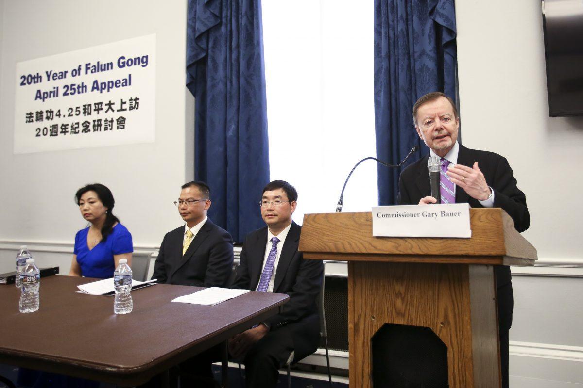 Gary Bauer, commissioner of the U.S. Commission on International Religious Freedom, speaks at the 20th anniversary of the April 25, 1999, Falun Gong appeal in Beijing, as victims of the persecution of Falun Gong, (L–R) Mei Xuan, Zhiheng Tang, and Caidong Shi, listen in the Cannon House Office Building in Washington on April 25, 2019. (Samira Bouaou/The Epoch Times)