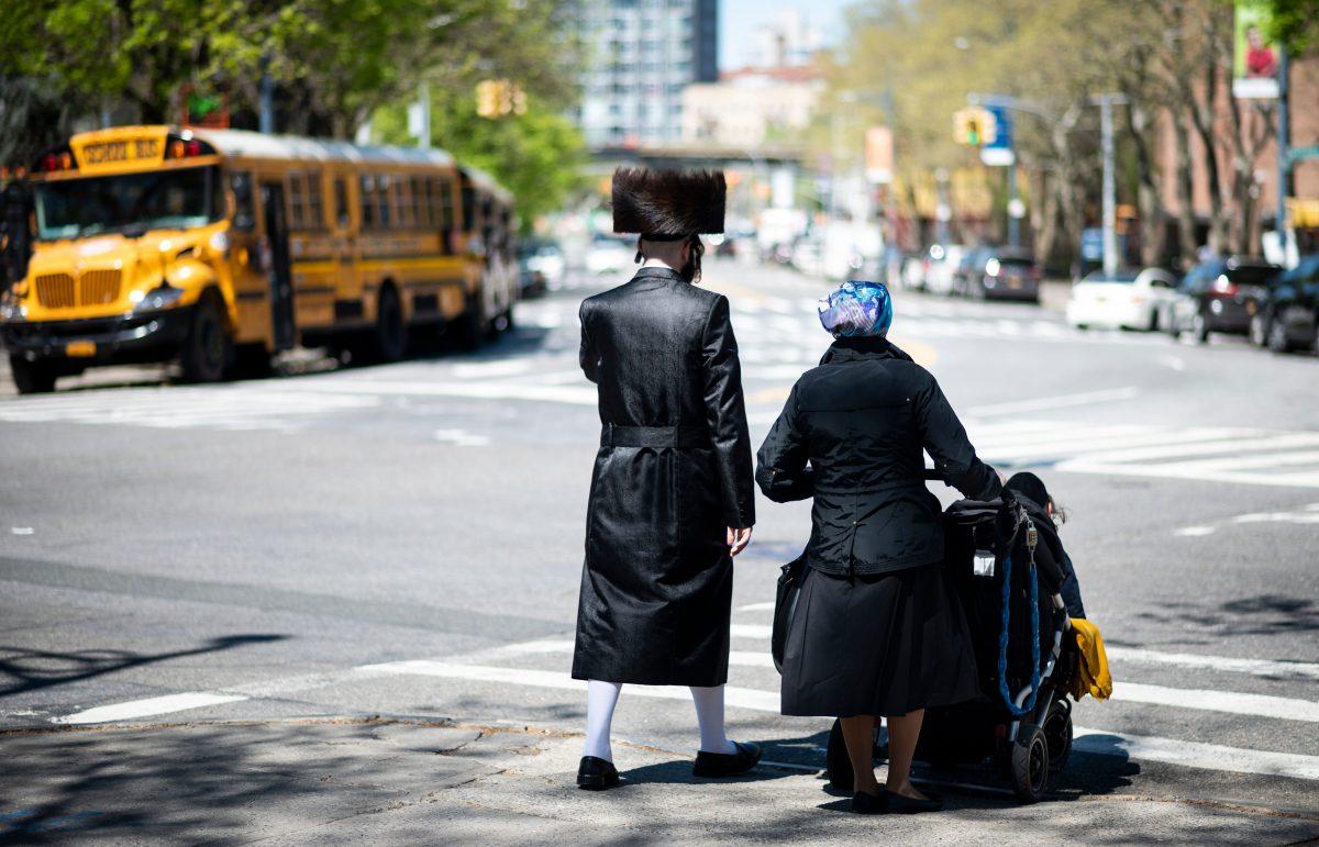 A Jewish family crosses a street in a Jewish quarter of Brooklyn's Williamsburg neighborhood in New York on April 24, 2019. (JOHANNES EISELE/AFP/Getty Images)
