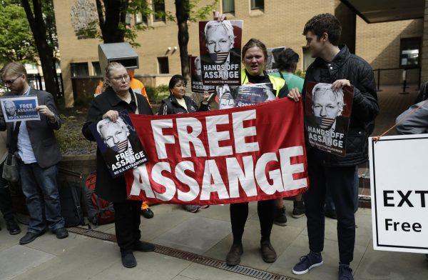 Protesters outside court as Julian Assange will appear to be sentenced on charges of jumping British bail seven years ago, in London, on May 1, 2019. (Matt Dunham/AP)