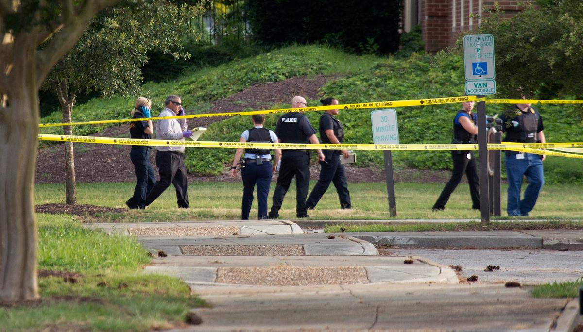 Police work the scene where 12 people were killed during a mass shooting at the Virginia Beach city public works building in Virginia Beach, Va. on May 31, 2019. (L. Todd Spencer/The Virginian-Pilot via AP)
