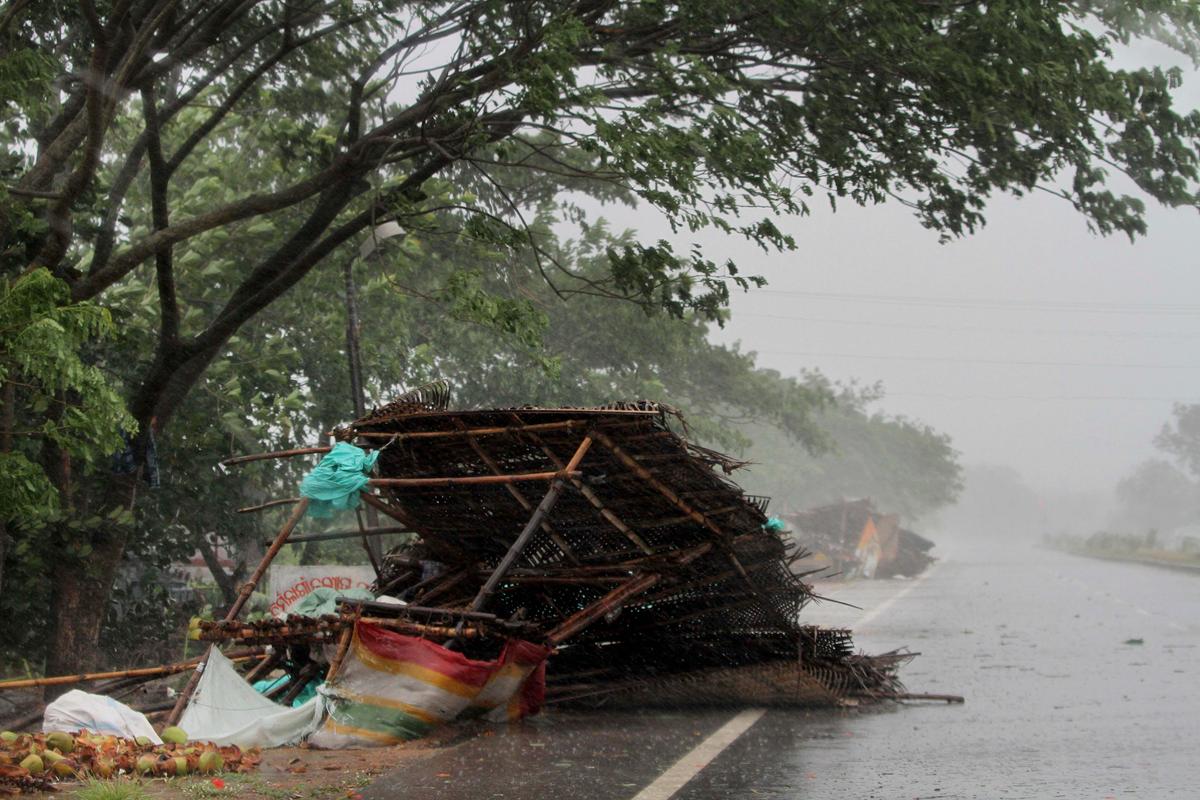 Street shops are seen collapsed due to gusty winds ahead of the landfall of cyclone Fani on the outskirts of Puri, in the Indian state of Odisha, Friday, May 3, 2019. (AP Photo)