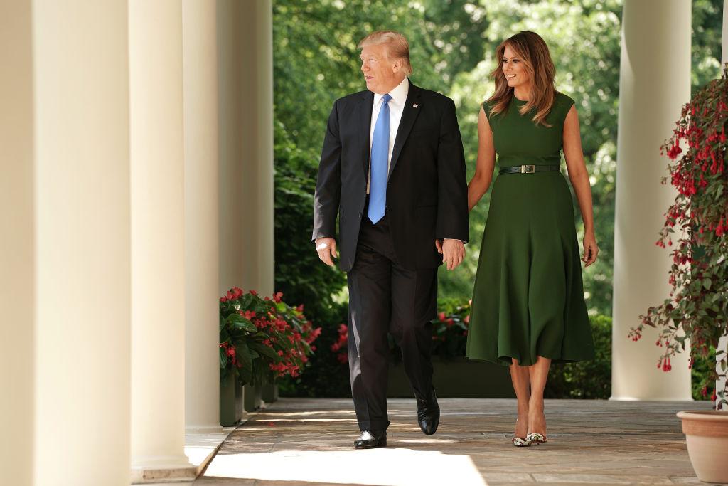 President Donald Trump (L) and First Lady Melania Trump walk out of the Oval Office during a National Day of Prayer service in the Rose Garden at the White House on May 2, 2019. (Chip Somodevilla/Getty Images)
