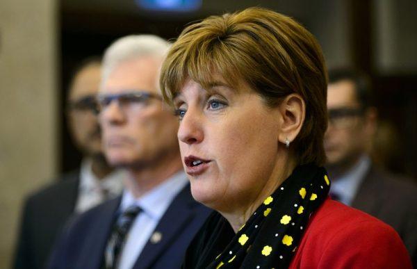 Marie-Claude Bibeau, minister of agriculture and agri-food updates on the government's response to the canola trade dispute with China during a news conference in Ottawa, Ontario. (Sean Kilpatrick/The Canadian Press via The Associated Press)