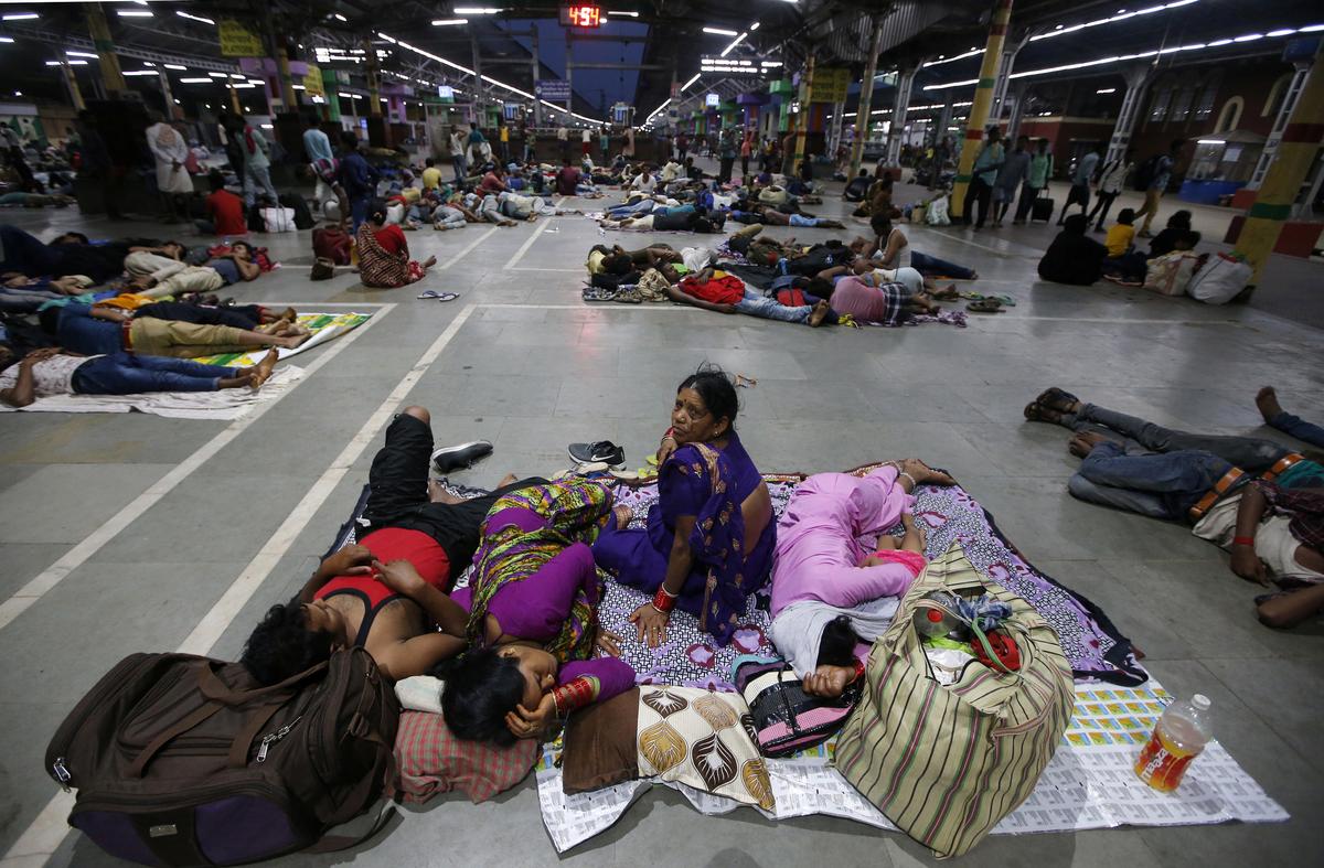 Stranded passengers rest inside a railway station after trains between Kolkata and Odisha were cancelled ahead of Cyclone Fani, in Kolkata, India, May 3, 2019. (Rupak De Chowdhuri/Reuters)