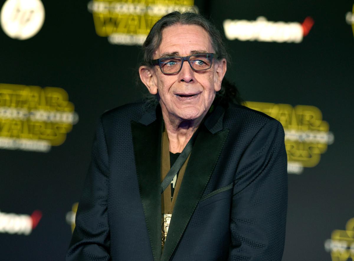 Peter Mayhew arrives at the world premiere of "Star Wars: The Force Awakens" in Los Angeles. Mayhew, who played the rugged, beloved, and furry Wookiee Chewbacca in the “Star Wars” films, has died. (©AP | Jordan Strauss)
