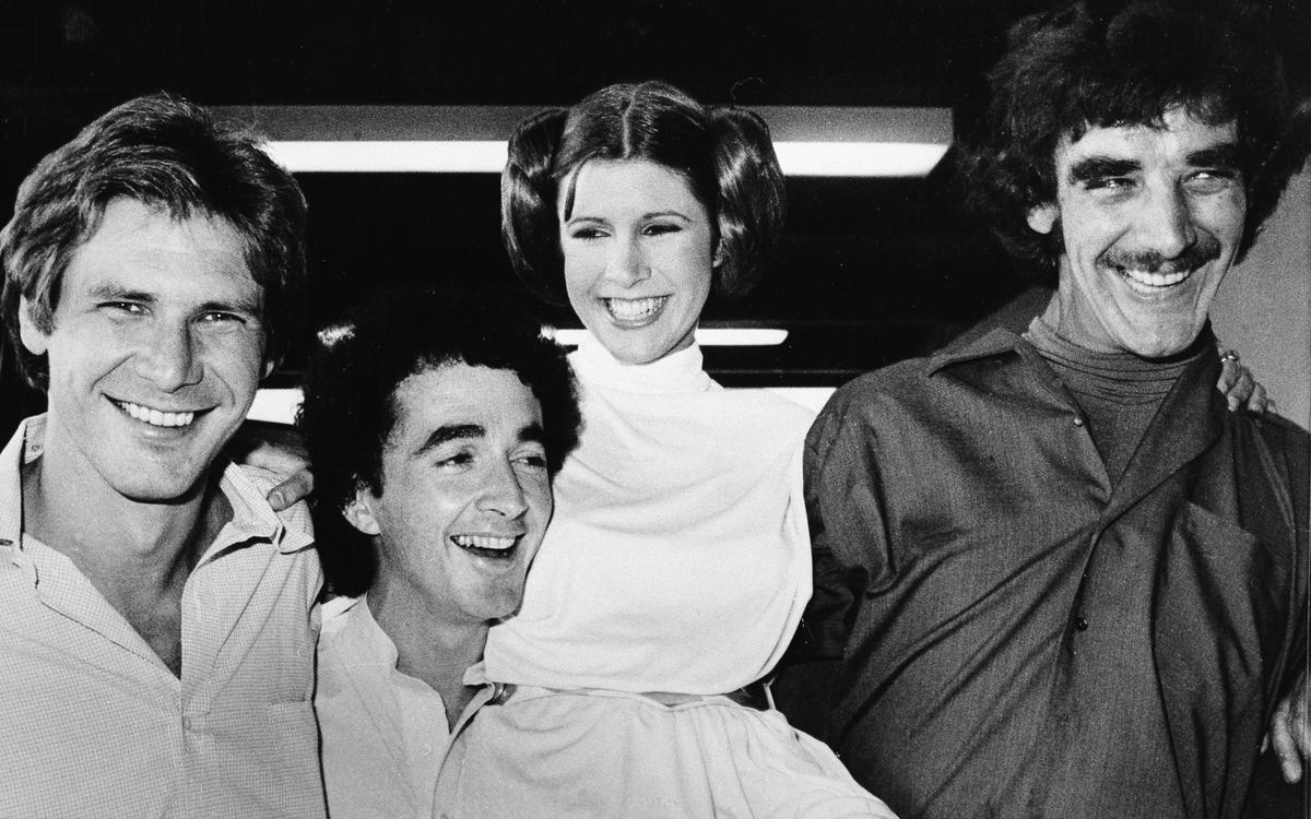 In this Oct. 5, 1978, file photo are the actors featured in the "Star Wars" movie: from left, Harrison Ford, who played Han Solo; Anthony Daniels, who played the robot C3P0; Carrie Fisher, who played Princess Leia; and Peter Mayhew, who played the Wookie, Chewbacca. (©AP| George Brich)