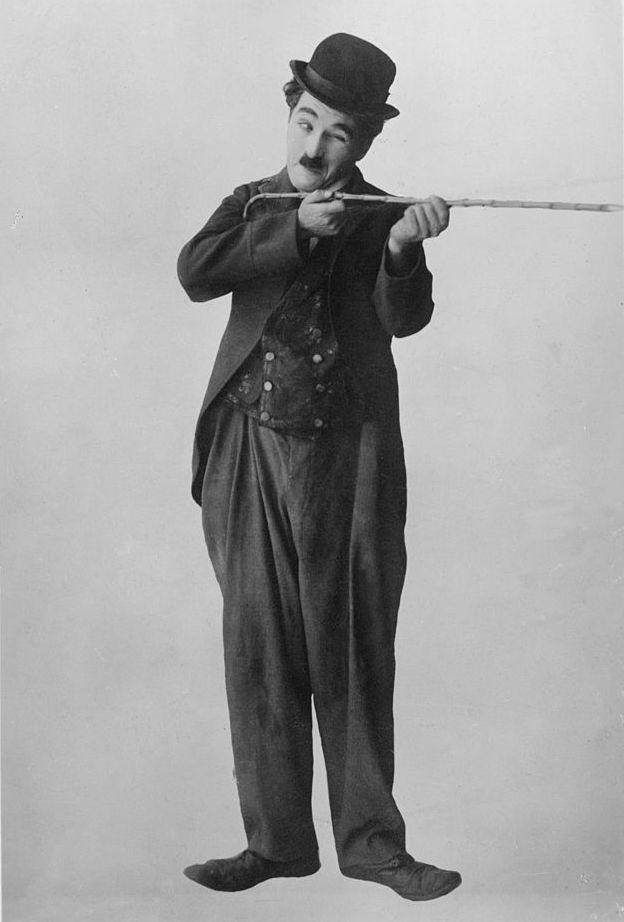 Chaplin with his walking stick, in character as "The Tramp," circa 1925 (©Getty Images | <a href="https://www.gettyimages.com/detail/news-photo/british-comic-actor-and-film-director-charlie-chaplin-takes-news-photo/55740056">Edward Gooch Collection</a>)