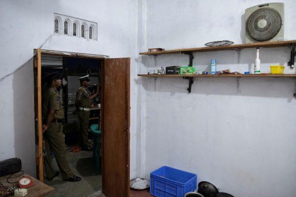 Police officers stand outside a room in a watchtower at a training camp allegedly linked to Islamist extremists, in Kattankudy near Batticaloa, Sri Lanka, on May 5, 2019. (Danish Siddiqui/Reuters)