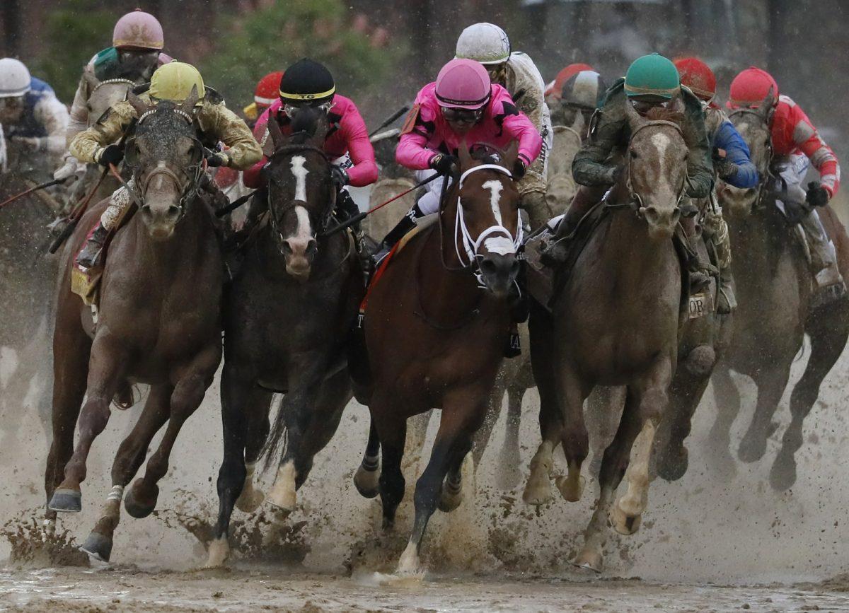 Flavien Prat on Country House (L) races against Luis Saez on Maximum Security, third from left, during the 145th running of the Kentucky Derby horse race at Churchill Downs in Louisville, Ky., on,May 4, 2019. (John Minchillo/AP Photo)